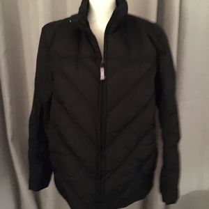 Woman’s black puffer coat